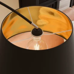 Lindby Esti gulvlampe, sort/guld, stof, højde 192 cm