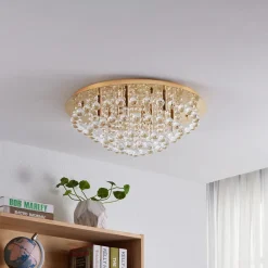 Lindby loftlampe Gillion, 8 lyskilder, guld, krystal, Ø 55cm