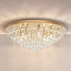 Lindby loftlampe Gillion, 8 lyskilder, guld, krystal, Ø 55cm