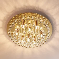 Lindby loftlampe Gillion, 8 lyskilder, guld, krystal, Ø 55cm
