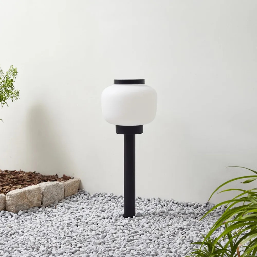 Lindby Terrassebelysning>Orfeas sokkellampe, sort/hvid, aluminium, Ø 24 cm