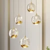 Lucande Pendellamper|Pendellamper>LED-pendellampe Hayley, Ø 30 cm, 5 lyskilder, guld, glas