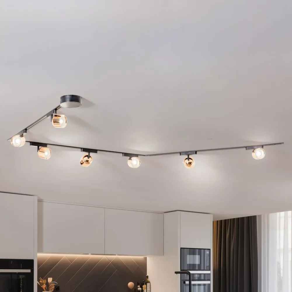 Lindby Lumaro skinnesystem, spots, 7 lyskilder, guld, Ø8cm,48V,dæmpbar