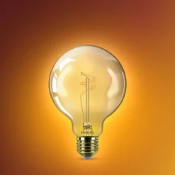 Philips LED-globepære E27 G95 3,1 W guld 1.800 K dæmpbar