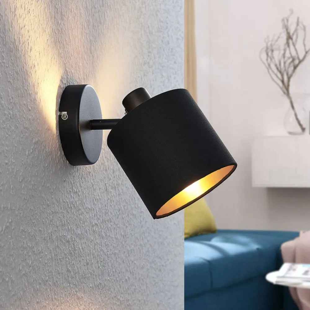 Vasilia væglampe i sort og guld, 1 lyskilde.^Lindby