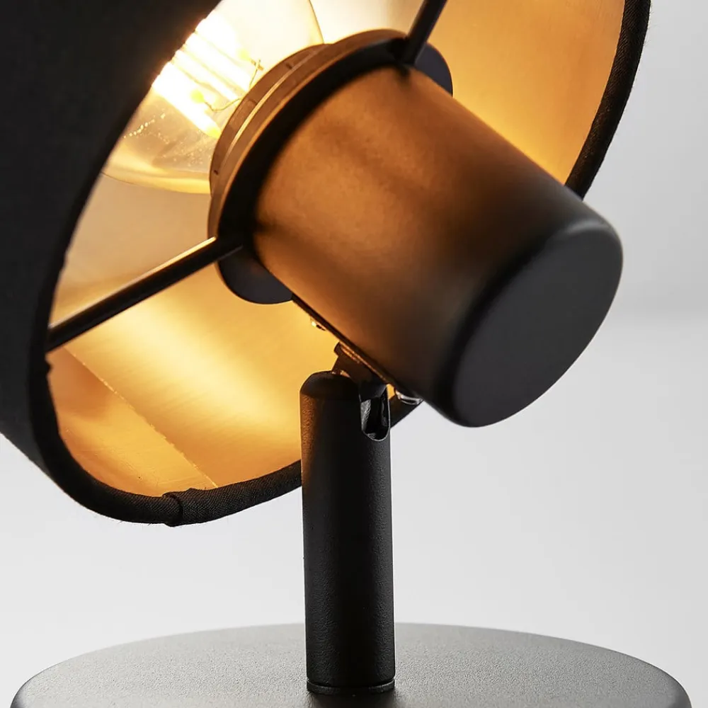 Vasilia væglampe i sort og guld, 1 lyskilde.^Lindby